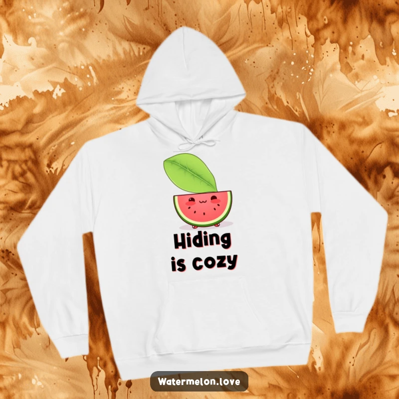 Funny hoodie with a blushing Kawaii watermelon slice discreetly peeking from behind a large leaf, offering warmth and shy charm.