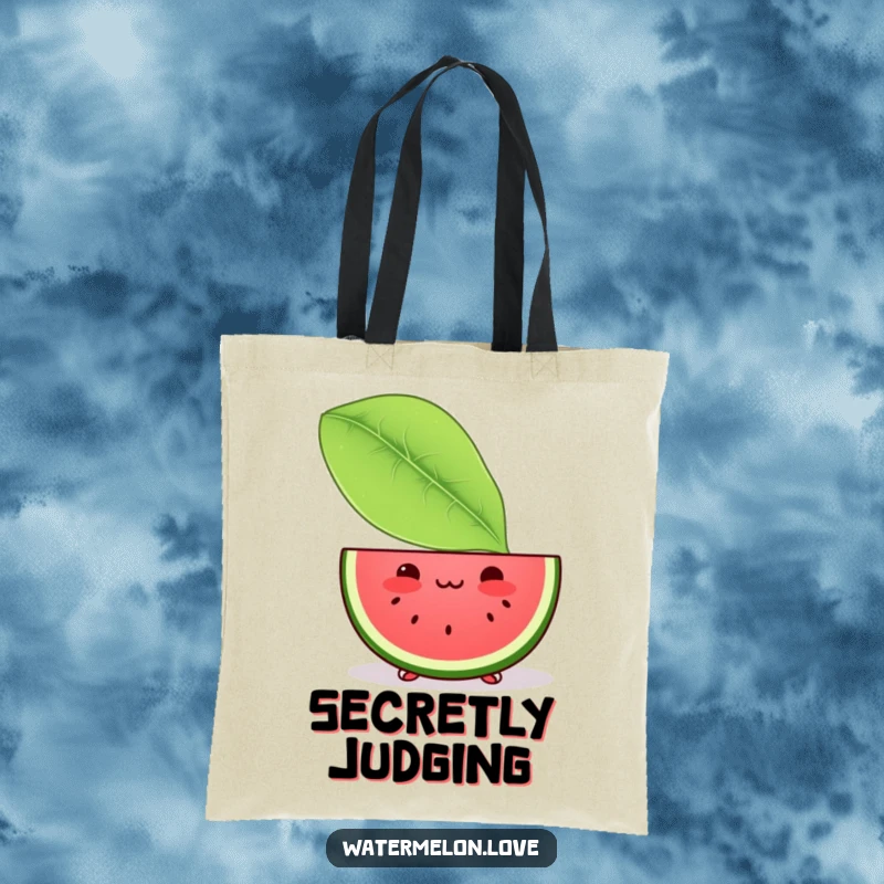 Funny tote bag with a shy Kawaii watermelon slice peeking from behind a giant leaf, perfect for carrying daily essentials with a hint of blush.